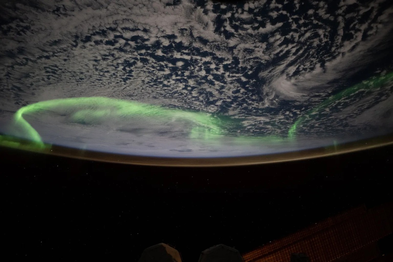 Aurora Australis
The aurora australis arcs above a partly cloudy Indian Ocean in this photograph from the International Space Station as it orbited 269 miles above in between Australia and Antarctica  ...