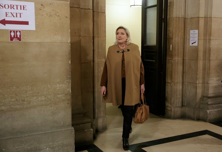 President of the parliamentary group of the French far-right Rassemblement National (RN) party, Marine Le Pen arrives after a break during her appeal trial on charges of embezzlement of European publi ...