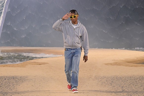 PARIS, FRANCE - JUNE 23: (EDITORIAL USE ONLY - For Non-Editorial use please seek approval from Fashion House) Designer Pharrell Williams acknowledge the audience on the runway after the Louis Vuitton  ...