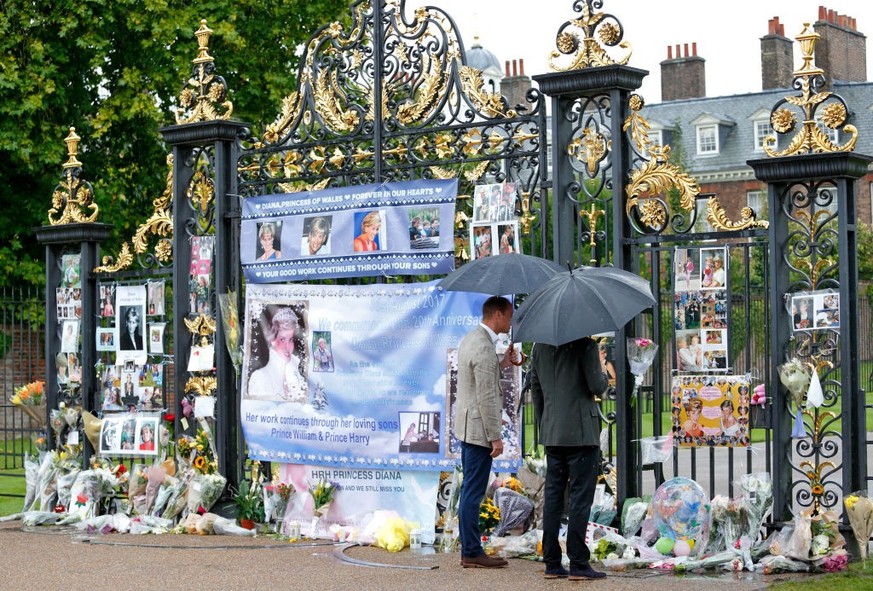 LONDON, UNITED KINGDOM - AUGUST 30: (EMBARGOED FOR PUBLICATION IN UK NEWSPAPERS UNTIL 48 HOURS AFTER CREATE DATE AND TIME) Prince William, Duke of Cambridge and Prince Harry view tributes to Diana, Pr ...