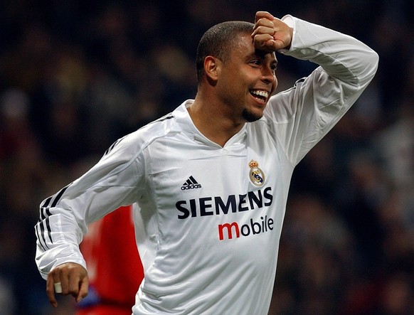 Brazilian Real Madrid player Ronaldo celebrates his goal during his Spanish league soccer match against Zaragoza in Madrid, Sunday, Jan. 16, 2005. Real Madrid won their match with 3-1. (AP Photo/Alvar ...