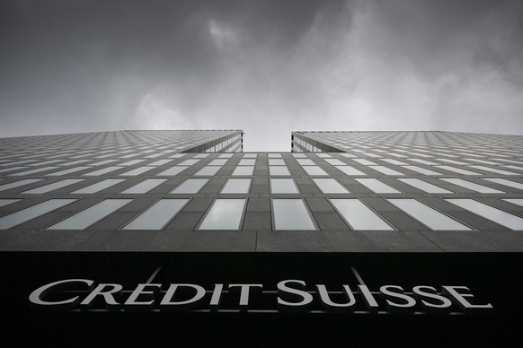 FILE - Grey clouds cover the sky over a building of the Credit Suisse bank in Zurich, Switzerland, on Feb. 21, 2022. Battered shares of Credit Suisse lost more than one-quarter of their value Wednesda ...