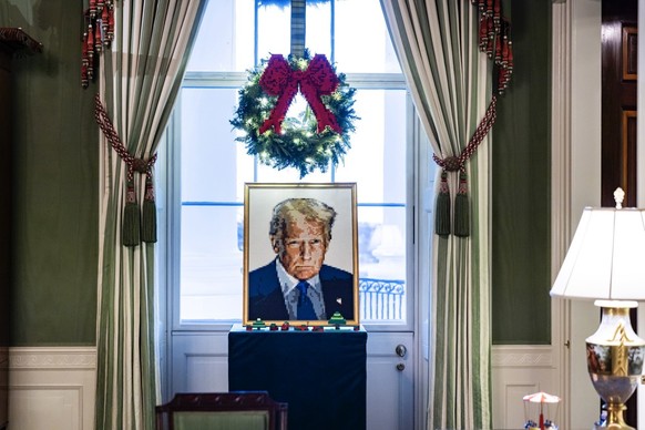 epa12562173 A portrait of US President Donald Trump made of Lego in the East Room of the White House during a holiday decoration tour for the media in Washington, DC, USA, 01 December 2025. US First L ...
