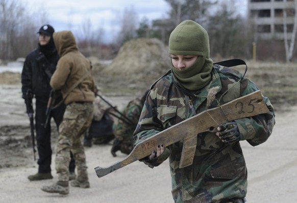 epa11175477 Ukrainian civilians take part in a military training for civilians organised by the &#039;Right Sector&#039; near the Western Ukrainian city of Lviv, 23 February 2024. Right Sector said th ...