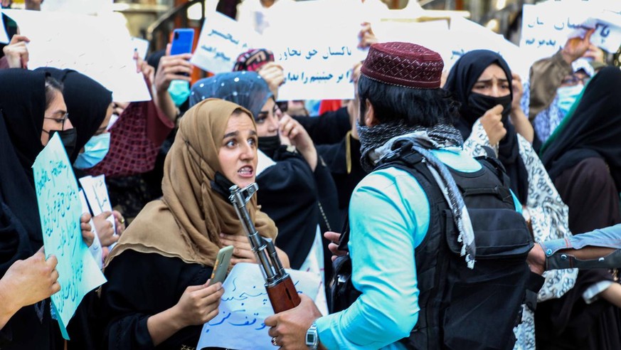 epa09452998 Afghans hold placards shouting anti-Pakistan slogans during a protest in Kabul, Afghanistan, 07 September 2021.The demonstrations began after Ahmad Massoud, leading the National Resistance ...