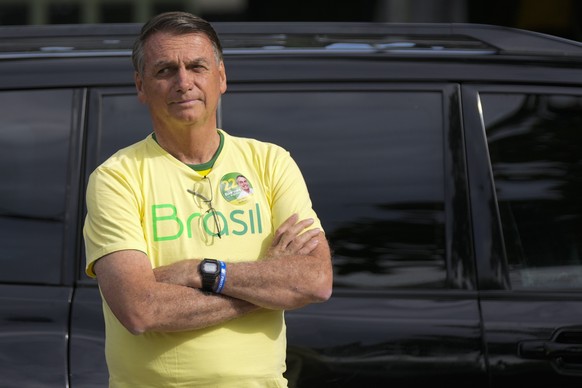 Brazilian President Jair Bolsonaro, who is running for another term, arrives to vote in a second round presidential election in Rio de Janeiro, Brazil, Sunday, Oct. 30, 2022. (AP Photo/Silvia Izquierd ...