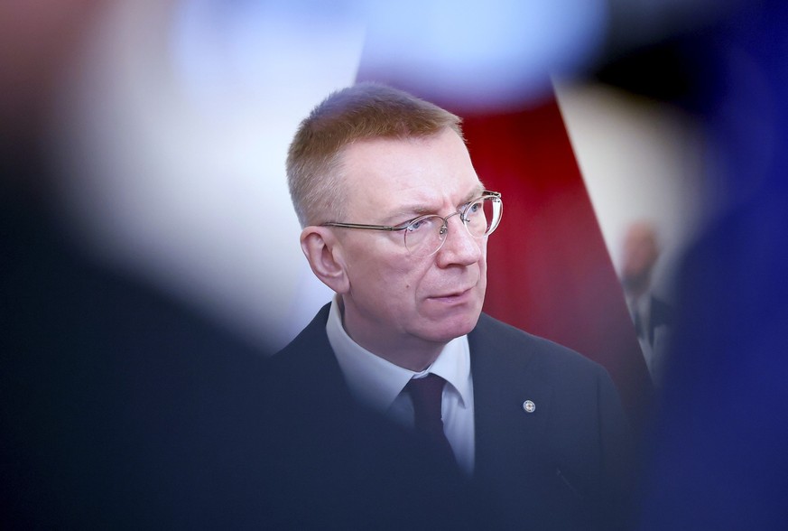 epa12864317 Latvian President Edgars Rinkevics attends a press conference with Moldovan President Maia Sandu (not pictured) after their meeting in Riga, Latvia, 01 April 2026. Sandu is in Latvia to st ...
