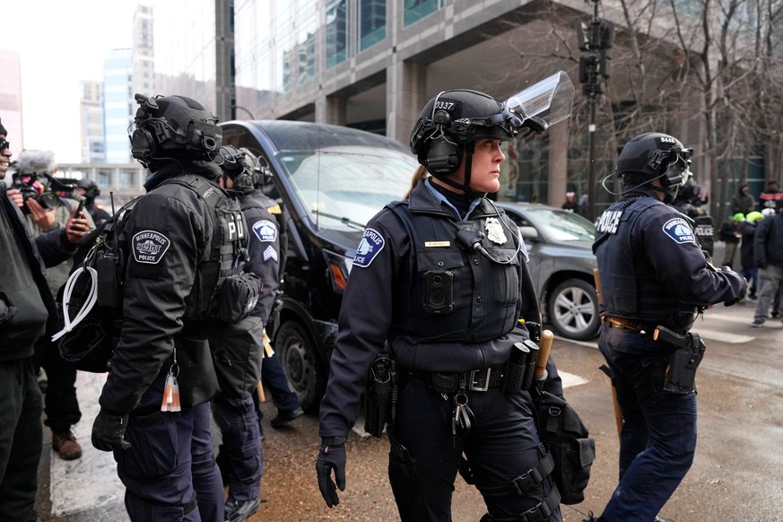 Minneapolis Police officers secure the intersection where protesters are gathered Saturday, Jan. 17, 2026, in Minneapolis. (AP Photo/Yuki Iwamura)
Immigration Enforcement Minnesota