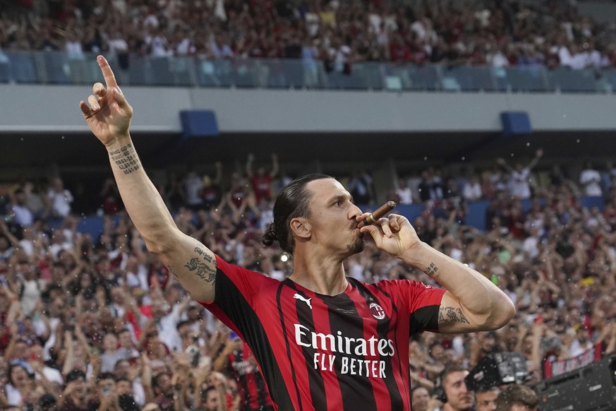 AC Milan&#039;s Zlatan Ibrahimovic puffs a cigar as he celebrates after winning a Serie A soccer match between AC Milan and Sassuolo, in Reggio Emilia&#039;s Mapei Stadium, Italy, Sunday, May 22, 2022 ...