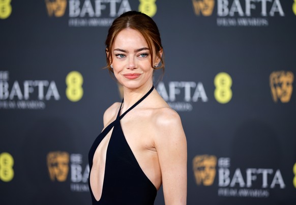 epa12768957 US actor Emma Stone poses on the red carpet at the EE BAFTA Film Awards 2026 at the Royal Festival Hall in London, Britain, 22 February 2026. The ceremony is hosted by the British Academy  ...