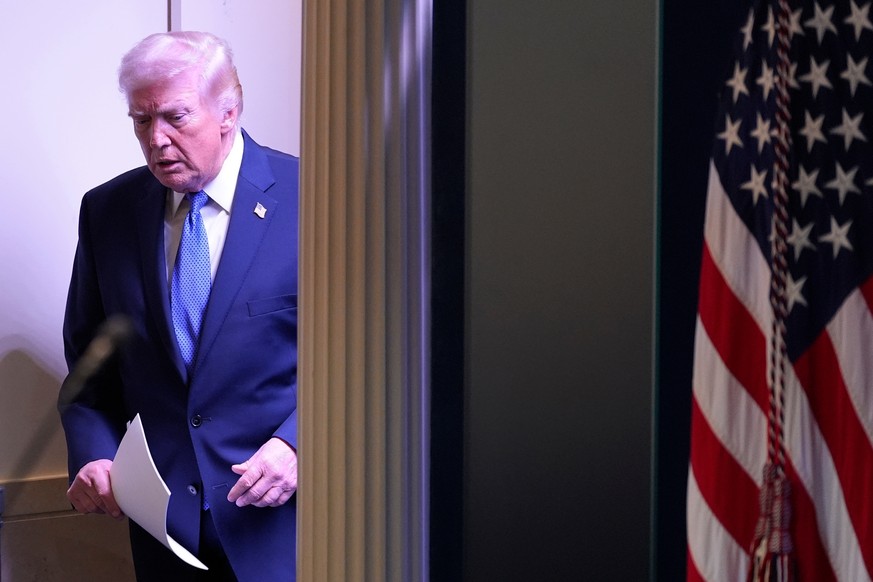 KEYPIX - President Donald Trump walks into the James Brady Press Briefing Room at the White House to speak to members of the media, Friday, Feb. 20, 2026, in Washington. (AP Photo/Alex Brandon)