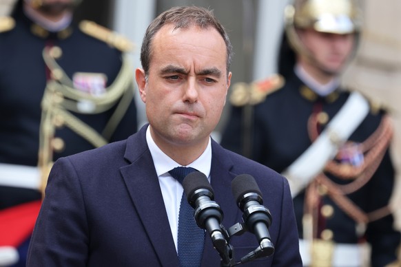 epa12367111 France&#039;s newly appointed Prime Minister and former Minister of Armed Forces Sebastien Lecornu reacts as he speaks at the end of the handover ceremony at the Hotel Matignon in Paris, F ...