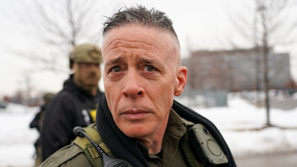epa12636397 US Border Patrol Cmdr. Gregory Bovino walks with federal agents outside the Bishop Henry Whipple Federal Building a day after a woman was shot and killed by an Immigration and Customs Enfo ...