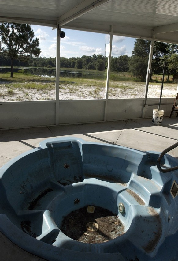 The hottub lies filled with dirt and leaves at the Florida naturist park in Hudson. The park is reportedly being sold to someone who will pour money into it's badly need renovations. (Credit Imag ...