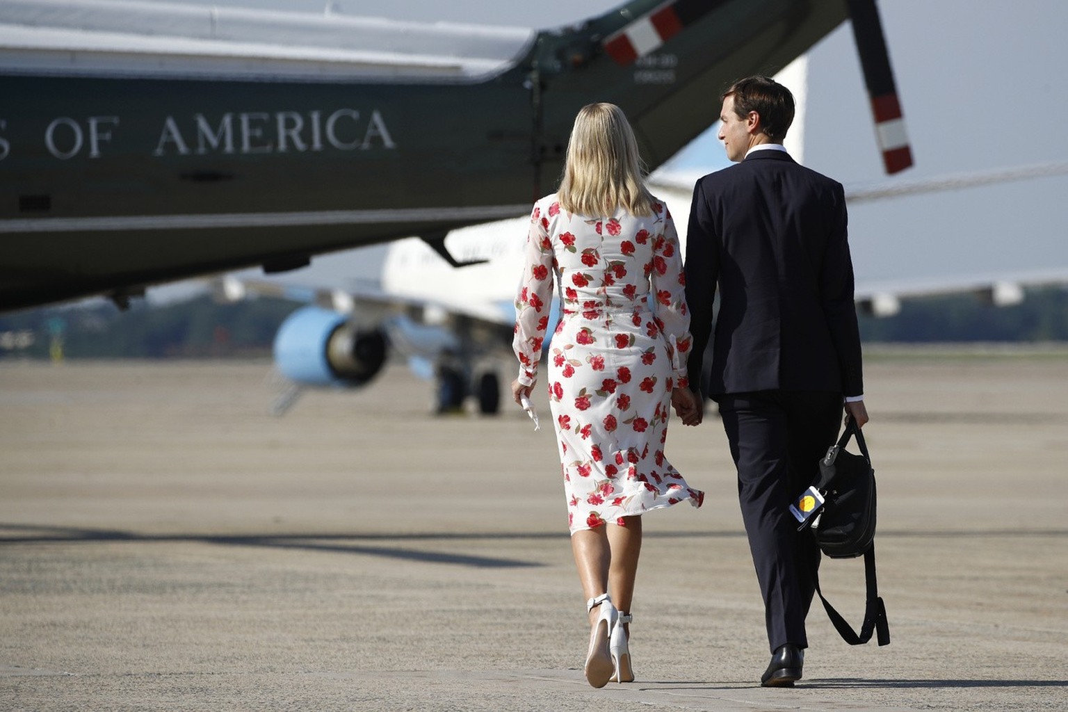 Ivanka Trump, left, the daughter and Advisor to President Donald Trump, and White House senior adviser Jared Kushner walk to Marine One after stepping off Air Force One with President Trump at Andrews ...