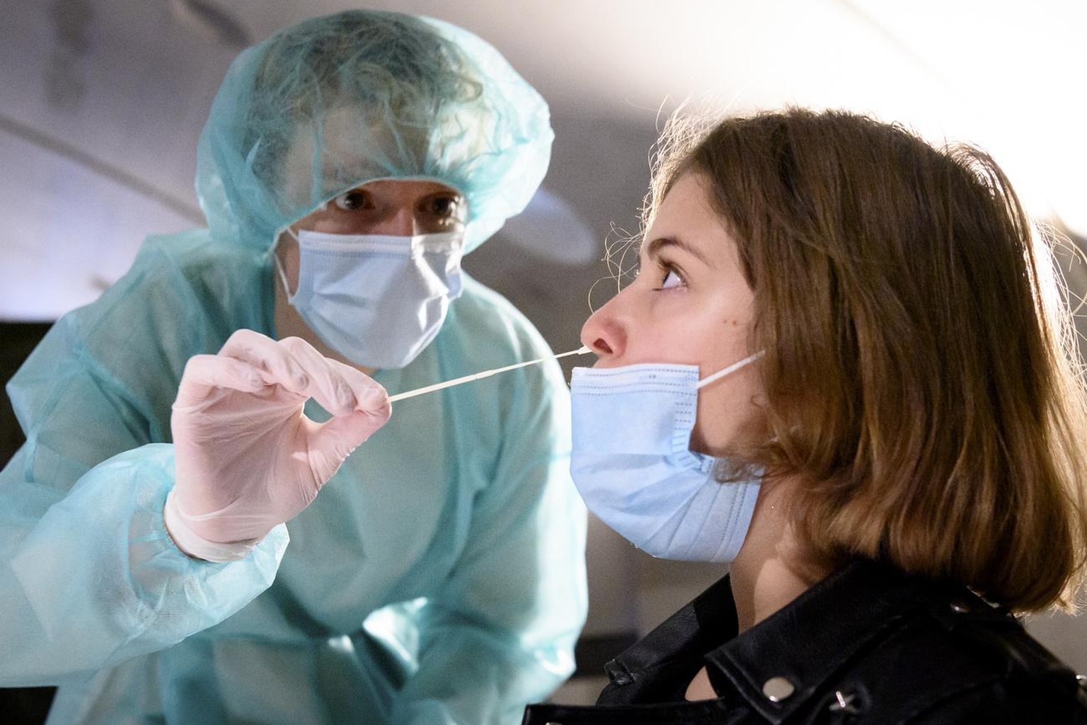 A health worker collects a nose swab sample for a polymerase chain reaction (PCR) test at the Mycorama coronavirus testing facility during the coronavirus disease (COVID-19) outbreak, in Cernier, Swit ...