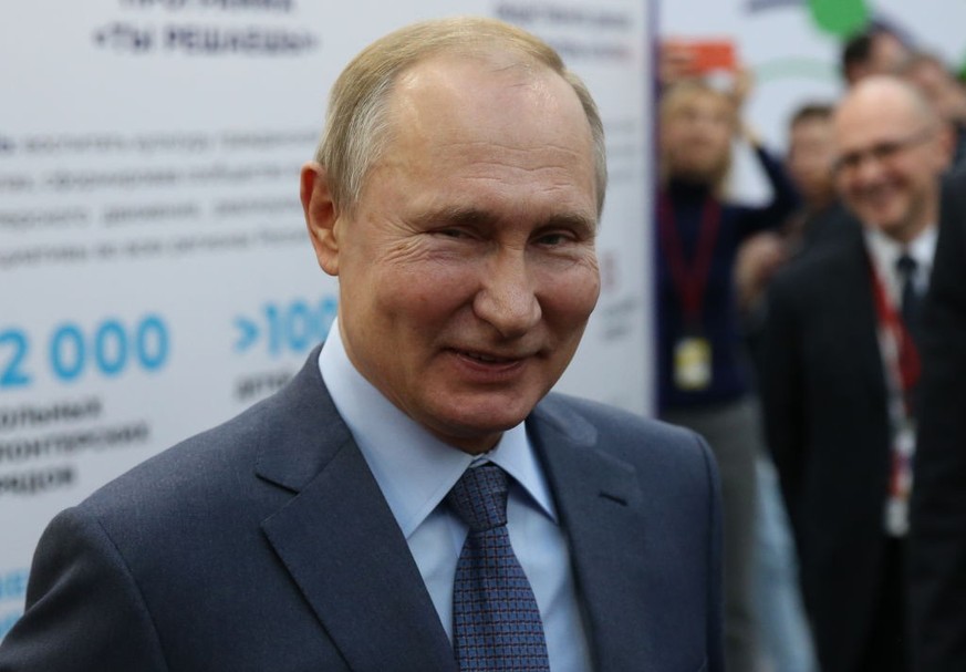 SOCHI, RUSSIA - DECEMBER,5 (RUSSIA OUT) Russian President Vladimir Putin (L) smiles during his talks with participants of the International Volunteer Forum in Sochi, Russia, December,5,2019. Russian P ...