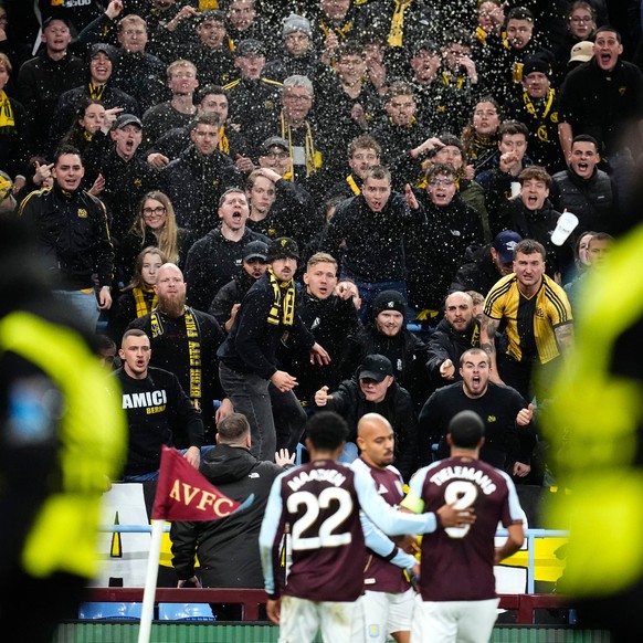 Young Boys' fans react as Aston Villa's Donyell Malen, center, celebrates after scoring the opening goal during the Europa League soccer match between Aston Villa and Young Boys in Birmingha ...
