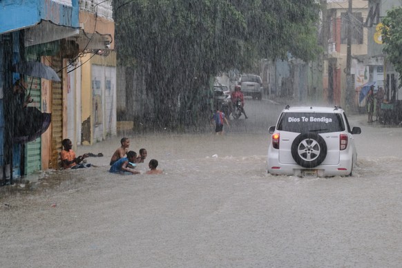 Children play in a street flooded by rains caused by Tropical Storm Melissa in Santo Domingo, Dominican Republic, Friday, Oct. 24, 2025. (AP Photo/Ricardo Hernandez)
Dominican Republic Extreme Weather