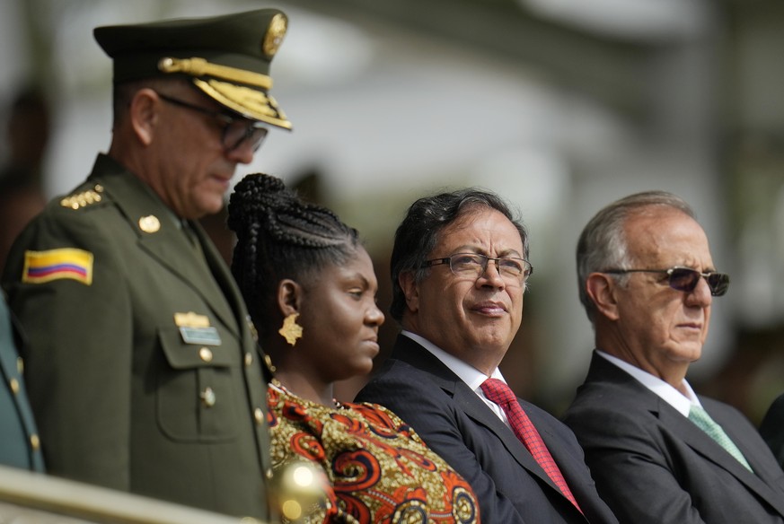 Outgoing Colombian National Police Director Gen. Jorge Luis Vargas, from left to right, Colombia's Vice President Francia Marquez, Colombia's President Gustavo Petro and Colombia's Defe ...