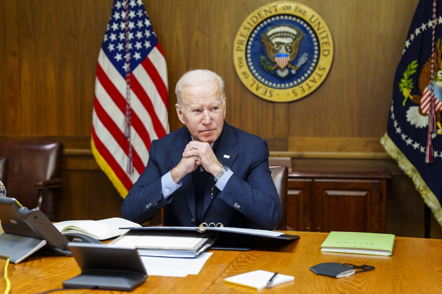 This image provided by The White House via Twitter shows President Joe Biden at Camp David, Md., Saturday, Feb. 12, 2022. Biden on Saturday again called on President Vladimir Putin to pull back more t ...