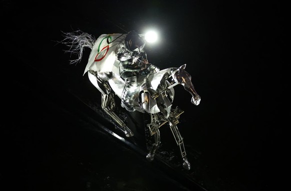 PARIS, FRANCE - JULY 26: The Horsewoman, wearing the Flag of the International Olympic Committee (IOC), is seen on a Metal Horse the River Seine during the opening ceremony of the Olympic Games Paris  ...
