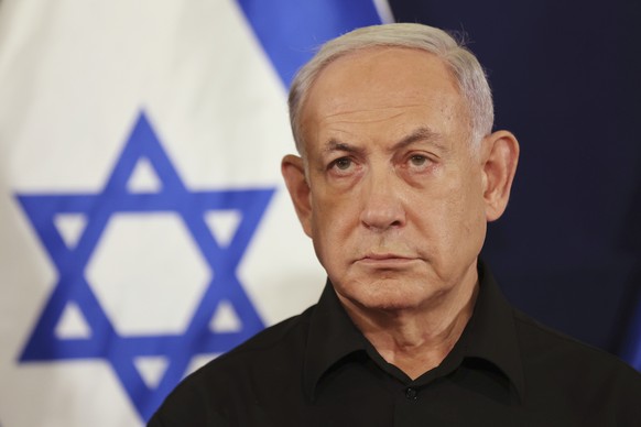 FILE - Israeli Prime Minister Benjamin Netanyahu attends a press conference with Defense Minister Yoav Gallant and Cabinet Minister Benny Gantz in the Kirya military base in Tel Aviv, Israel, Saturday ...