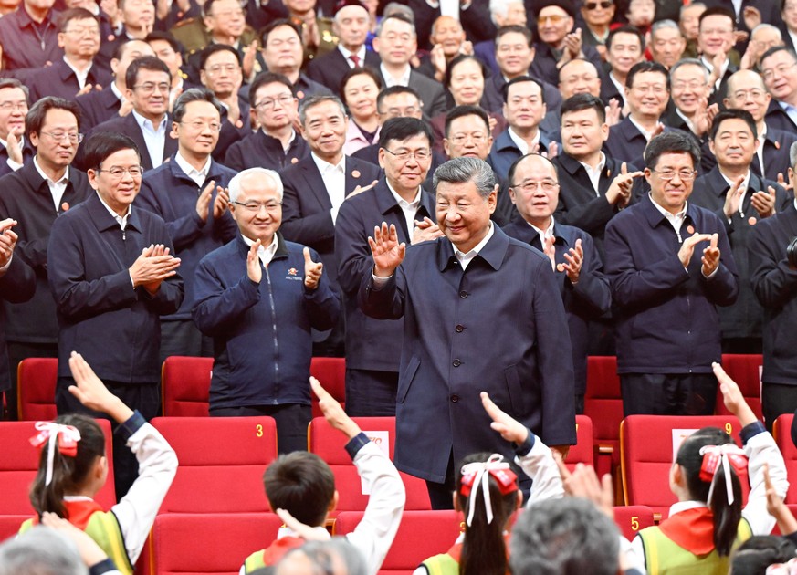 epa12406546 Chinese President Xi Jinping, general secretary of the Communist Party of China (CPC) Central Committee and chairman of the Central Military Commission, waves to the crowd while attending  ...