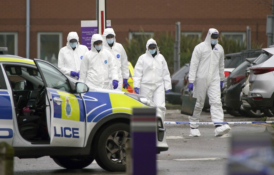 Forensic police officers walk outside Liverpool Women&#039;s Hospital after an explosion on Sunday killed one person and injured another, in Liverool, England, Tuesday, Nov. 16, 2021. British police h ...