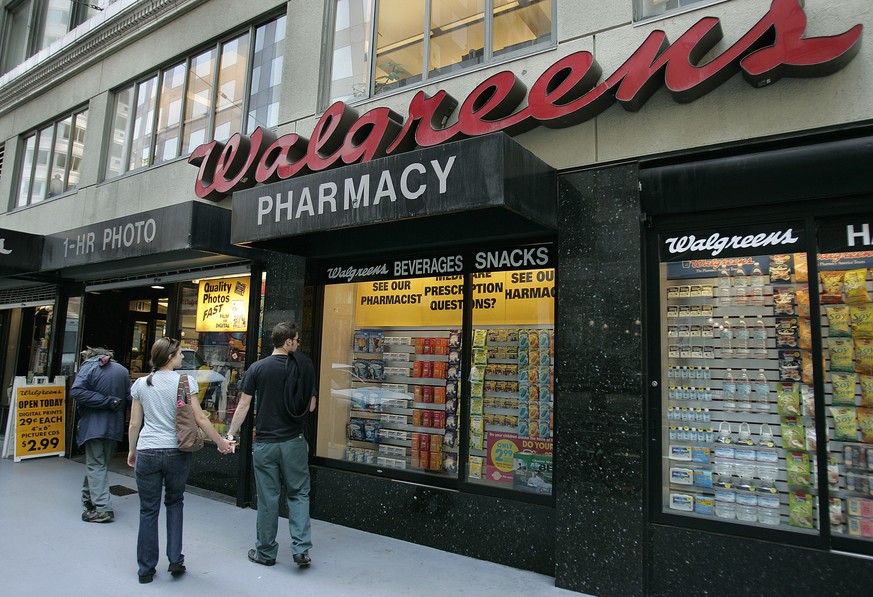 FILE - Window shoppers look at a Walgreens storefront in San Francisco on June 26, 2006. A federal judge ruled Wednesday, Aug. 10, 2022, that the pharmacy chain Walgreens can be held responsible for c ...