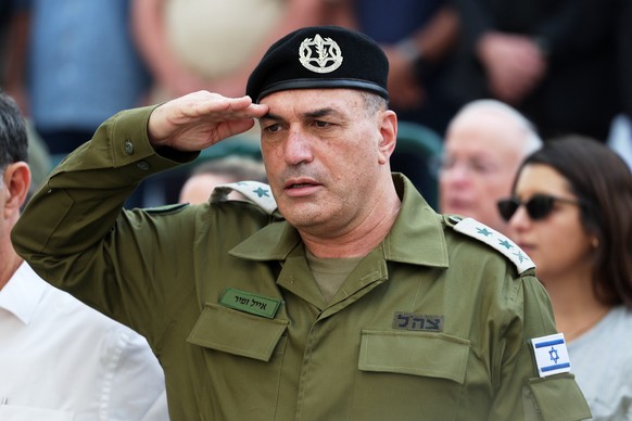 IDF chief of staff Eyal Zamir salutes during the funeral of Hadar Goldin an Israeli soldier killed in Gaza in 2014 and whose body had been held there until it was released Sunday, in Kfar Saba, Israel ...