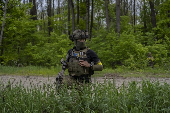 Steve, a member of the foreign legion from United States, guards a position during a mission against Russian positions in east Kharkiv region, Ukraine, Tuesday, May 17, 2022. (AP Photo/Bernat Armangue ...