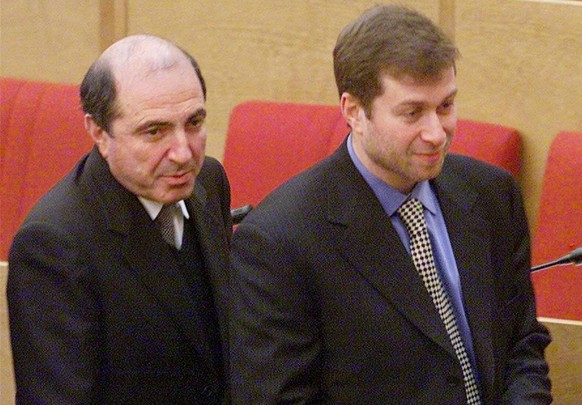 Russian businessman Roman Abramovich, right, and Boris Berezovsky, a controversial business tycoon, both parliament members, walk after the session of the State Duma, parliament&#039;s lower house, in ...