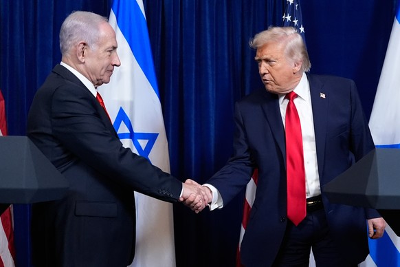 President Donald Trump shakes hands with Israel's Prime Minister Benjamin Netanyahu at the end of a news conference at Mar-a-Lago, Monday, Dec. 29, 2025, in Palm Beach, Fla. (AP Photo/Alex Brando ...