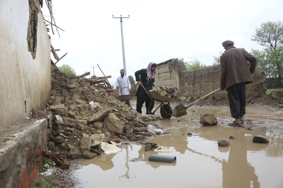 240415 -- PARWAN, April 15, 2024 -- People clear the ruins of a dwelling destroyed by the flood in east Afghanistan s Parwan Province, April 15, 2024. Thirty-three people have lost their lives and 27  ...