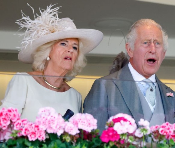 ASCOT, UNITED KINGDOM - JUNE 24: (EMBARGOED FOR PUBLICATION IN UK NEWSPAPERS UNTIL 24 HOURS AFTER CREATE DATE AND TIME) Queen Camilla, King Charles III and Lady Gabriella Windsor watch, from the Royal ...