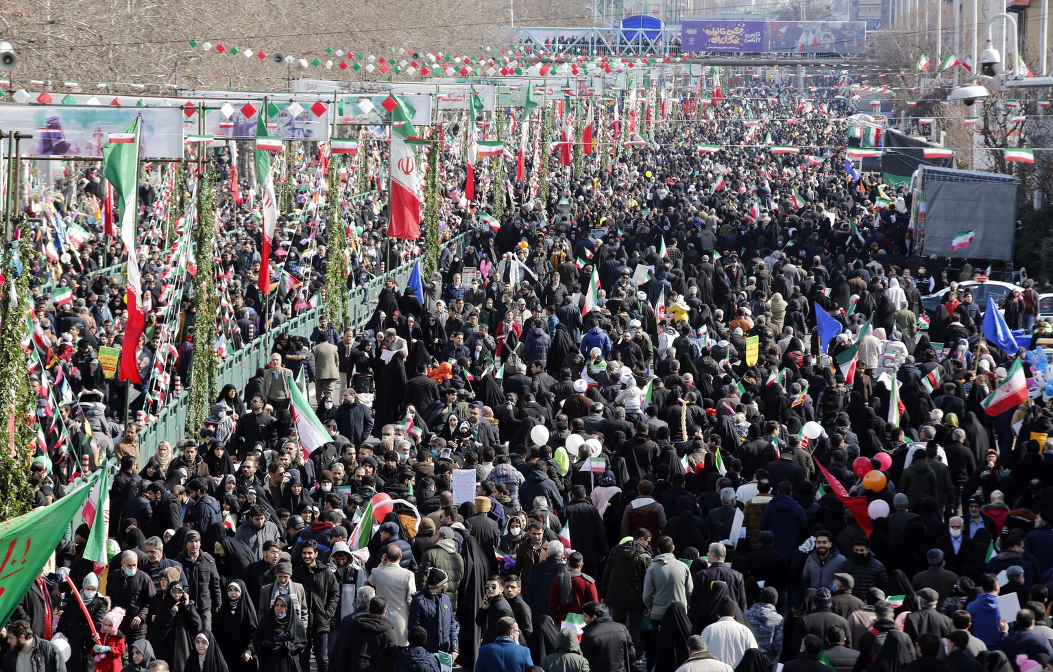 epa10460363 Iranians celebrate during the 44th anniversary of the 1979 Islamic Revolution, at the Azadi (Freedom) square in Tehran, Iran, 11 February 2023. The event marks the 44th anniversary of the  ...