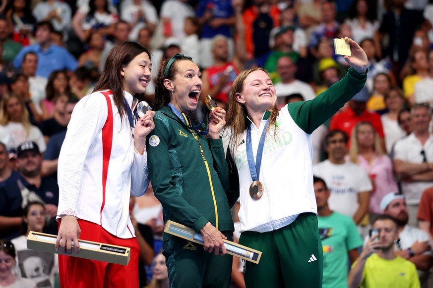 NANTERRE, FRANCE - JULY 29: Gold Medalist Tatjana Smith of Team South Africa (C), Silver Medalist Tang Qianting of Team People&#039;s Republic of China (L) and Bronze Medalist Mona McSharry of Team Re ...