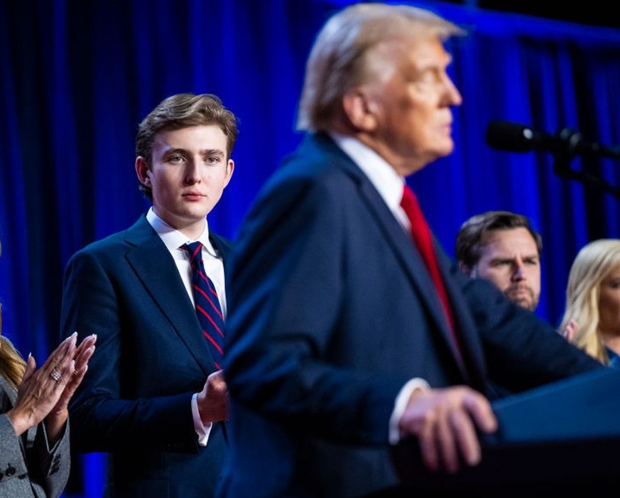 West Palm Beach, FL - November 6 : Wife Melania Trumo and son Barron Trump listen as Republican presidential nominee former President Donald Trump walks out on stage with his wife Melania after being  ...