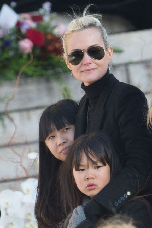 PARIS, FRANCE - DECEMBER 09: Laetitia Hallyday with her daughters Jade Hallyday (L) and Joy Hallyday (R) during Johnny Hallyday&#039;s Funeral at Eglise De La Madeleine on December 9, 2017 in Paris, F ...