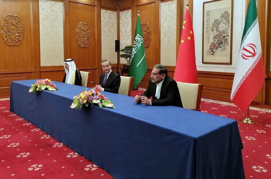 epa10513920 A handout photo made available by Nournews agency shows (R-L) Iranian secretary of the Supreme National Security Council Ali Shamkhani, Director of China&#039;s Office of the Central Forei ...