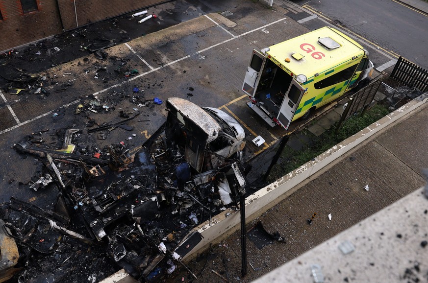 epa12843645 The burnt out remains of a Jewish ambulance service in London, Britain, 23 March 2026. The Met police are currently looking for three suspects after a Jewish ambulance service was destroye ...