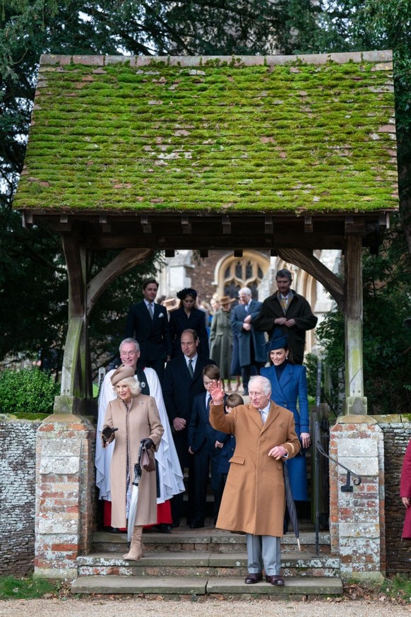 King Charles III and Queen Camilla, followed by the Prince of Wales, Prince George and the Princess of Wales, after attending the Christmas Day morning church service at St Mary Magdalene Church in Sa ...