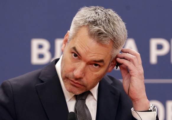 epa09830960 Austrian Chancellor Karl Nehammer looks on during a joint press conference with the Serbian Prime minister (not pictured) after their meeting in Belgrade, Serbia, 17 March 2022. Nehammer i ...