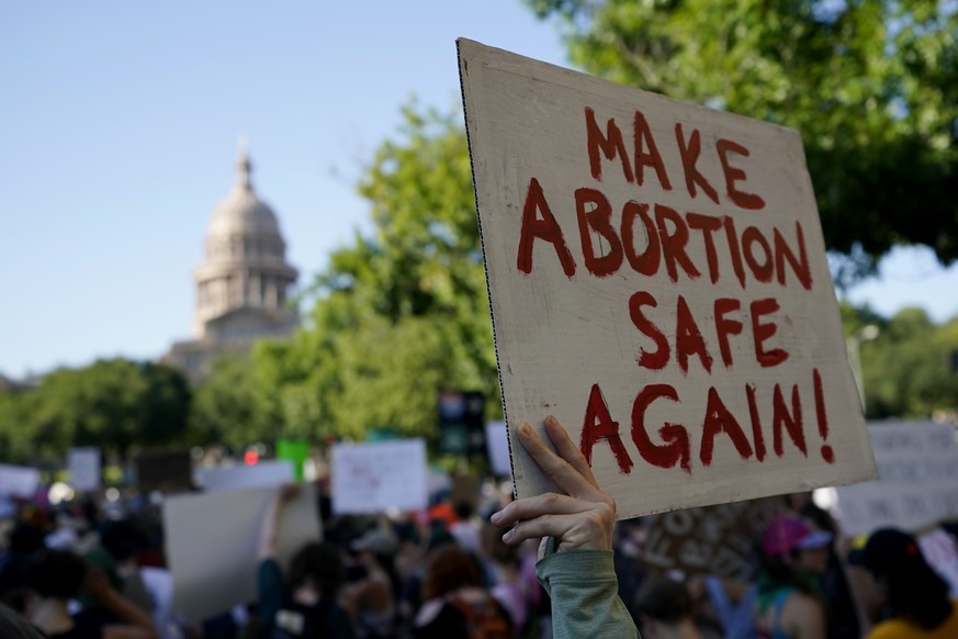 FILE - Demonstrators march and gather near the state capitol following the Supreme Court&#039;s decision to overturn Roe v. Wade, Friday, June 24, 2022, in Austin, Texas. A pregnant Texas woman whose  ...