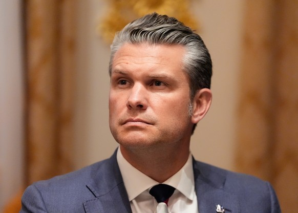Defense Secretary Pete Hegseth listens as President Donald Trump speaks before a lunch with Ukraine&#039;s President Volodymyr Zelenskyy in the Cabinet Room of the White House, Friday, Oct. 17, 2025,  ...