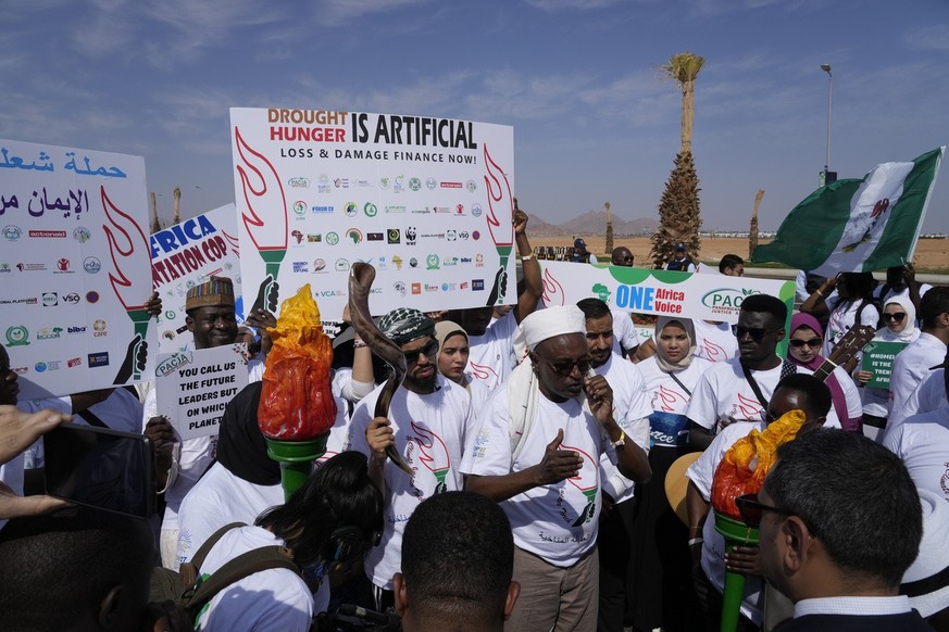 Demonstrators call for climate action on the African continent prior to the COP27 U.N. Climate Summit, Friday, Nov. 4, 2022, which start on Nov. 6, and is scheduled to end on Nov. 18, in Sharm el-Shei ...