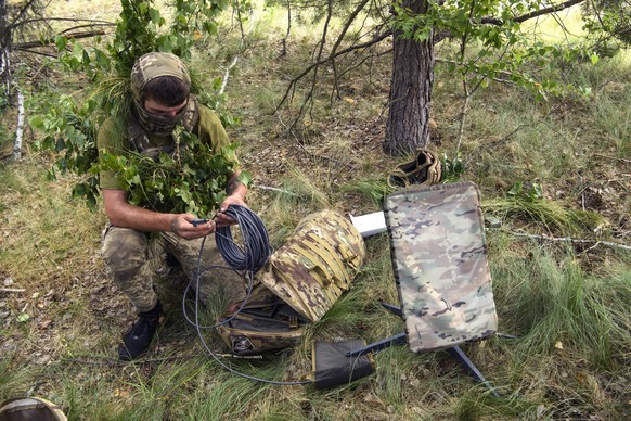 Ukrainian Soldiers Of The 61st Separate Mechanized Brigade During Military Exercises In The Chernihiv Region A Ukrainian soldier of the 61st Separate Mechanized Brigade uses the Starlink system during ...