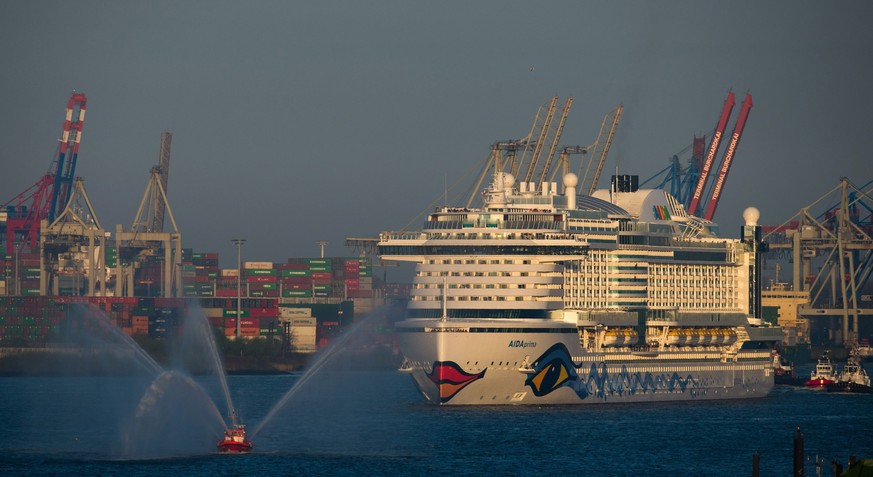 epa05269743 The new flagship of Aida Cruises, German cruise liner, Aida Prima, sails out of the Harbour in Hamburg, Germany, 21 April 2016 on it's way to the the Mediterranean. The ship which has ...