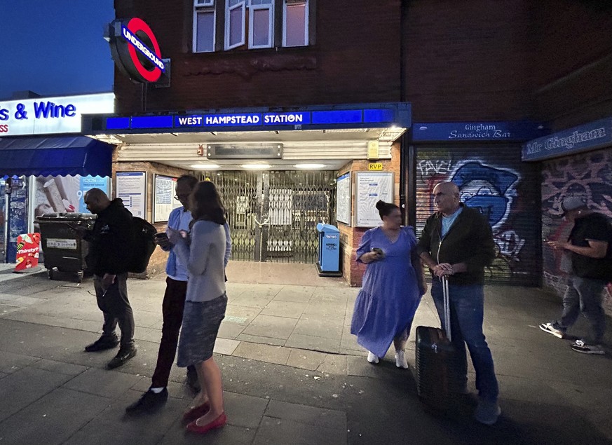 People stand outside the shuttered West Hampstead station at the beginning of a London Underground strike, Sunday, Sept. 7, 2025. (AP Photo/Brian Melley)
Britain-Subway Strike